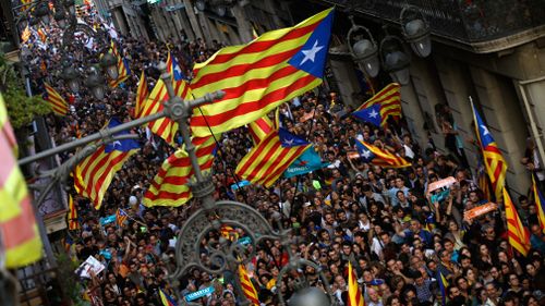 Pro-independence supporters gather near the Palau Generalitat in Barcelona, Spain. (AP)