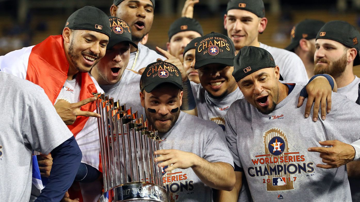 Carlos Correa #1, Jose Altuve #27  and teammates celebrate with other Houston Astros