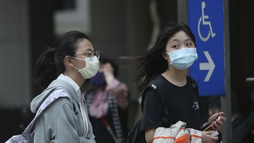 People wear face masks to protect against the spread of the coronavirus in Taipei, Taiwan.