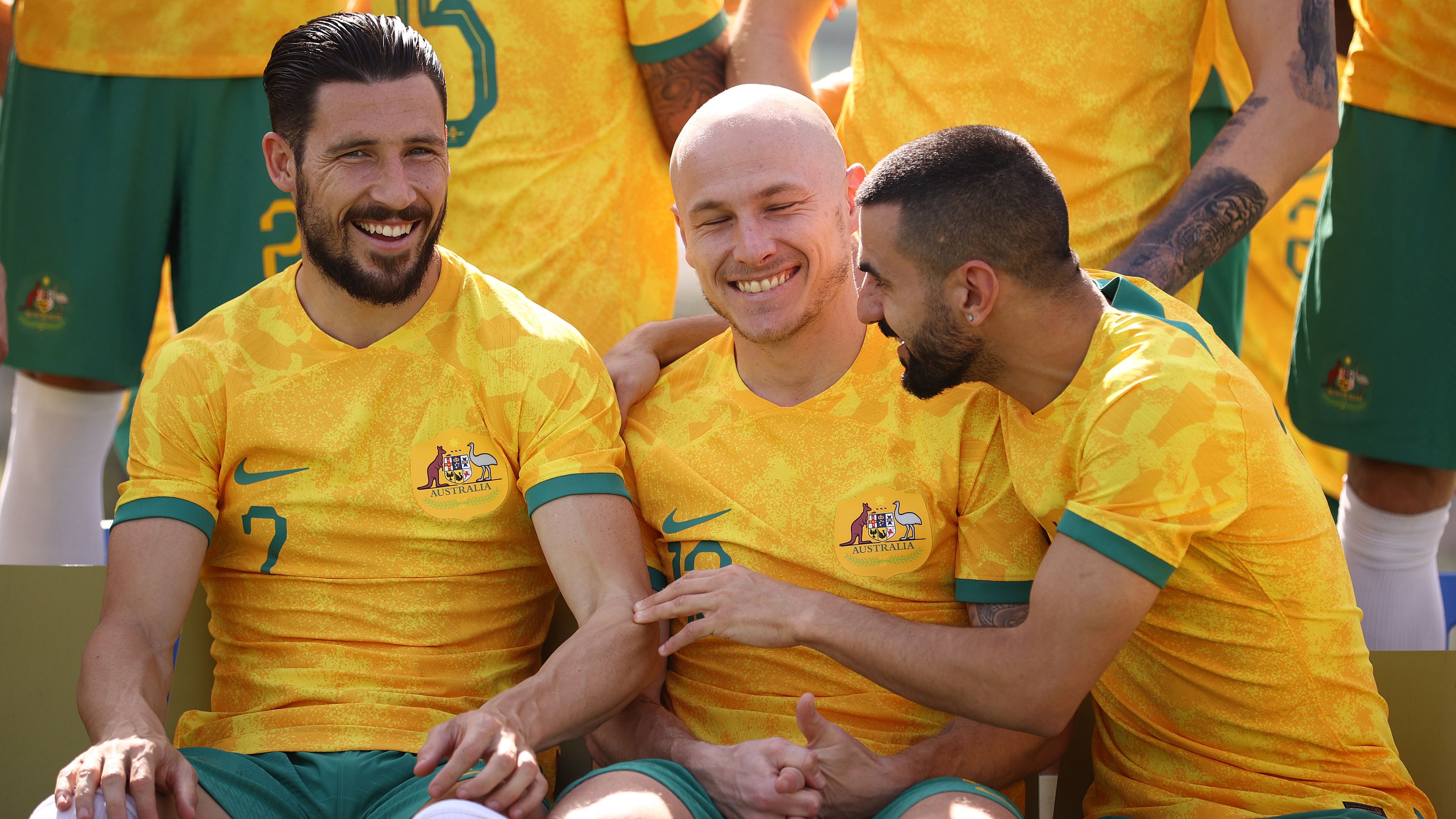 Mathew Leckie, Aaron Mooy and Aziz Behich pose during Australia&#x27;s official World Cup team photo.