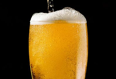 Glass of beer isolated on black background (Getty)