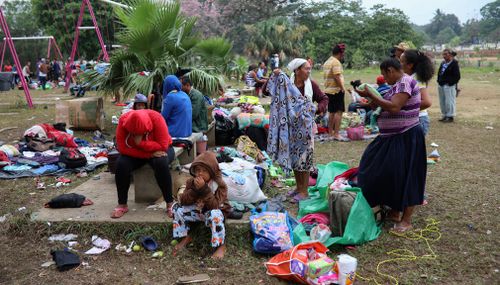 Central American migrants traveling with the annual "Stations of the Cross" caravan pack up their belongings as they prepare to depart from the sports club where they have been camping out in Mexico. (AP)