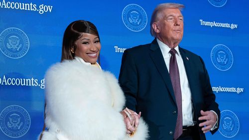 President Donald Trump greets Nicki Minaj during the event "Trump Accounts" at the Andrew W. Mellon Auditorium, Wednesday, Jan. 28, 2026, in Washington. 