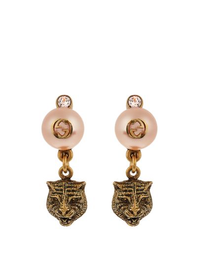 Gucci pearl effect earrings $345 at <a href="http://www.matchesfashion.com/au/products/Gucci-Pearl-effect-embellished-tiger-earrings-1074248" target="_blank">Matches</a>