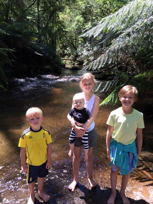 Evie (right) with her three siblings. 