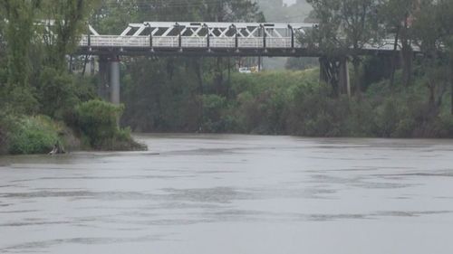 Some of the 100 members of the defence force sent to the town, plus SES volunteers, are door knocking those most at risk, as the Wilson River rises.