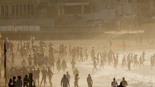 SYDNEY, AUSTRALIA - NOVEMBER 27: A packed Bondi Beach at sunrise on November 27, 2024 in Sydney, Australia. Some Australians experienced temperatures of 40 degrees plus last weekend.