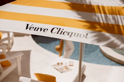 Hotel Clicquot - Veuve Clicquot striped umbrella by the pool