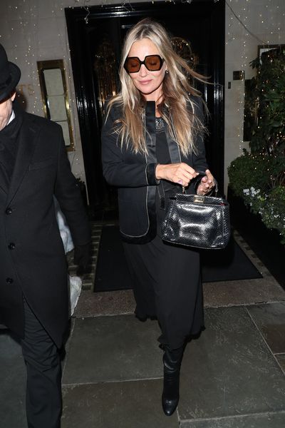 Kate Moss in yellow silk shirt with black leather bag in London on May 23 ~  I want her style - What celebrities wore and where to buy it. Celebrity  Style