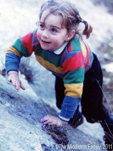 Kate Middleton climbing on a rock as a child