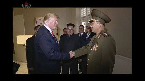 President Donald Trump shakes hands with No Kwang Chol, minister of the People's Armed Forces of North Korea. Picture: AP