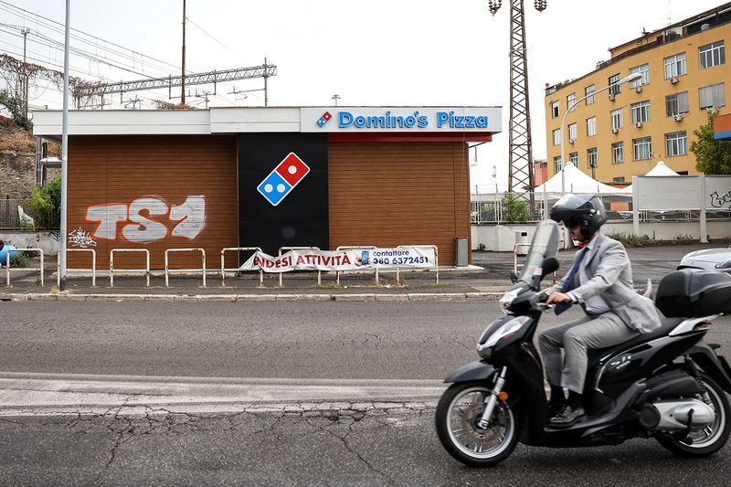 A &quot;For Sale&quot; banner outside a closed-down Domino&#x27;s Pizza Inc. store in Rome, Italy, on Tuesday, Aug. 9, 2022. 