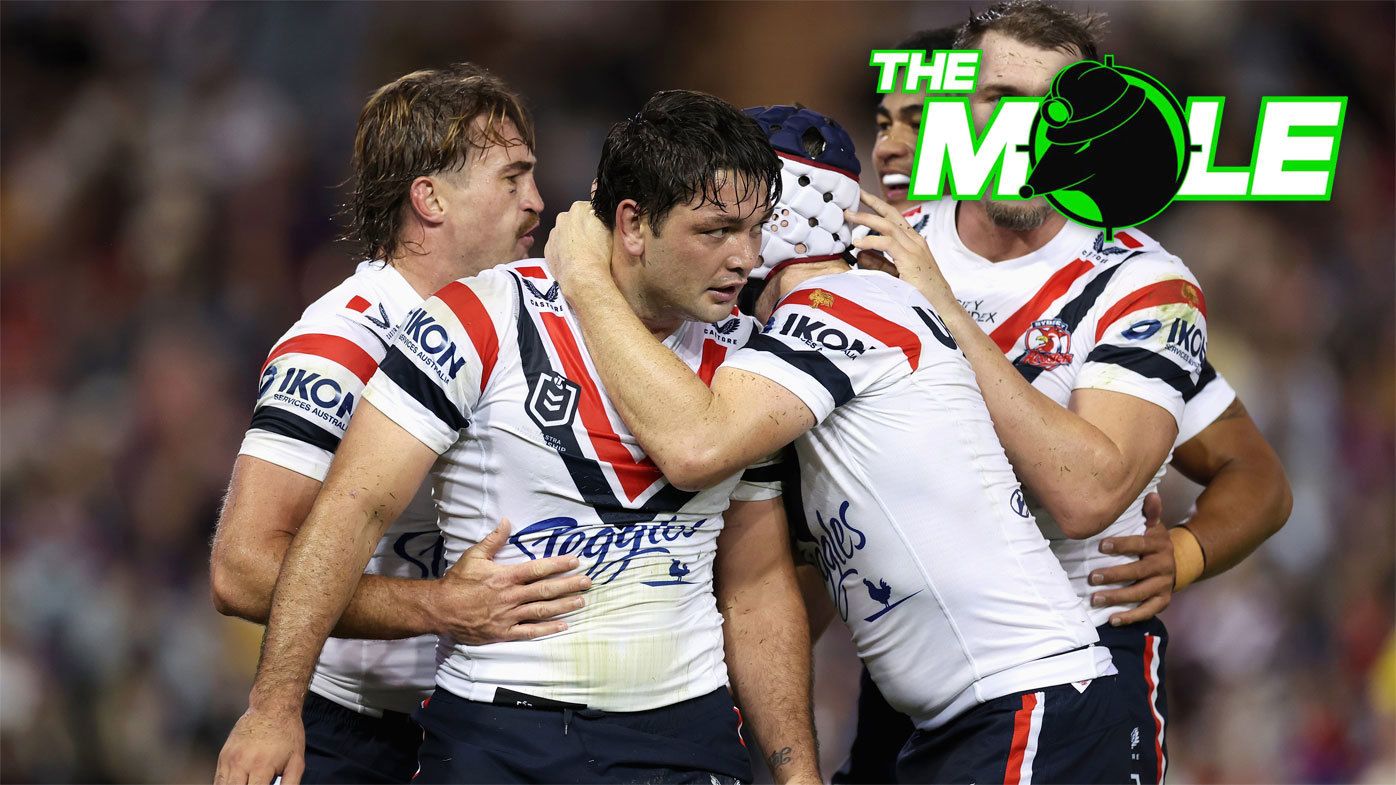 Roosters players celebrate with hooker Brandon Smith during their round six clash with the Knights.