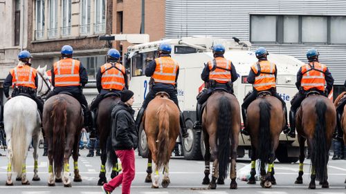 Riot police got involved in a tense stand off. (AAP/ Geert Vanden Wijngaert)