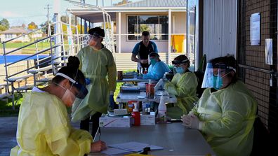 Health workers at the COVID-19 Dubbo West walk-in clinic on Howard Avenue in Dubbo.