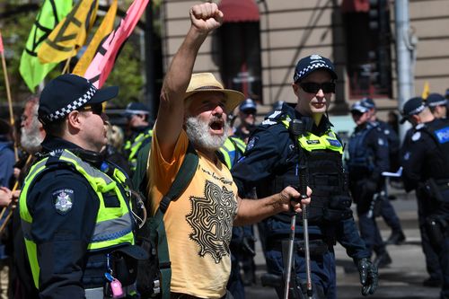 An Extinction Rebellion activist is arrested during a protest in Melbourne, Tuesday, October 8, 2019. 