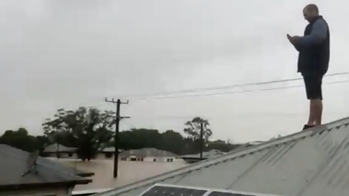 Family stranded on roof Casino Street Lismore Today help rescue in floods