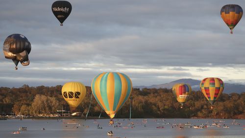 Hot air balloons over Lake Burley Griffin during the Canberra Balloon Spectacular festival in Canberra.