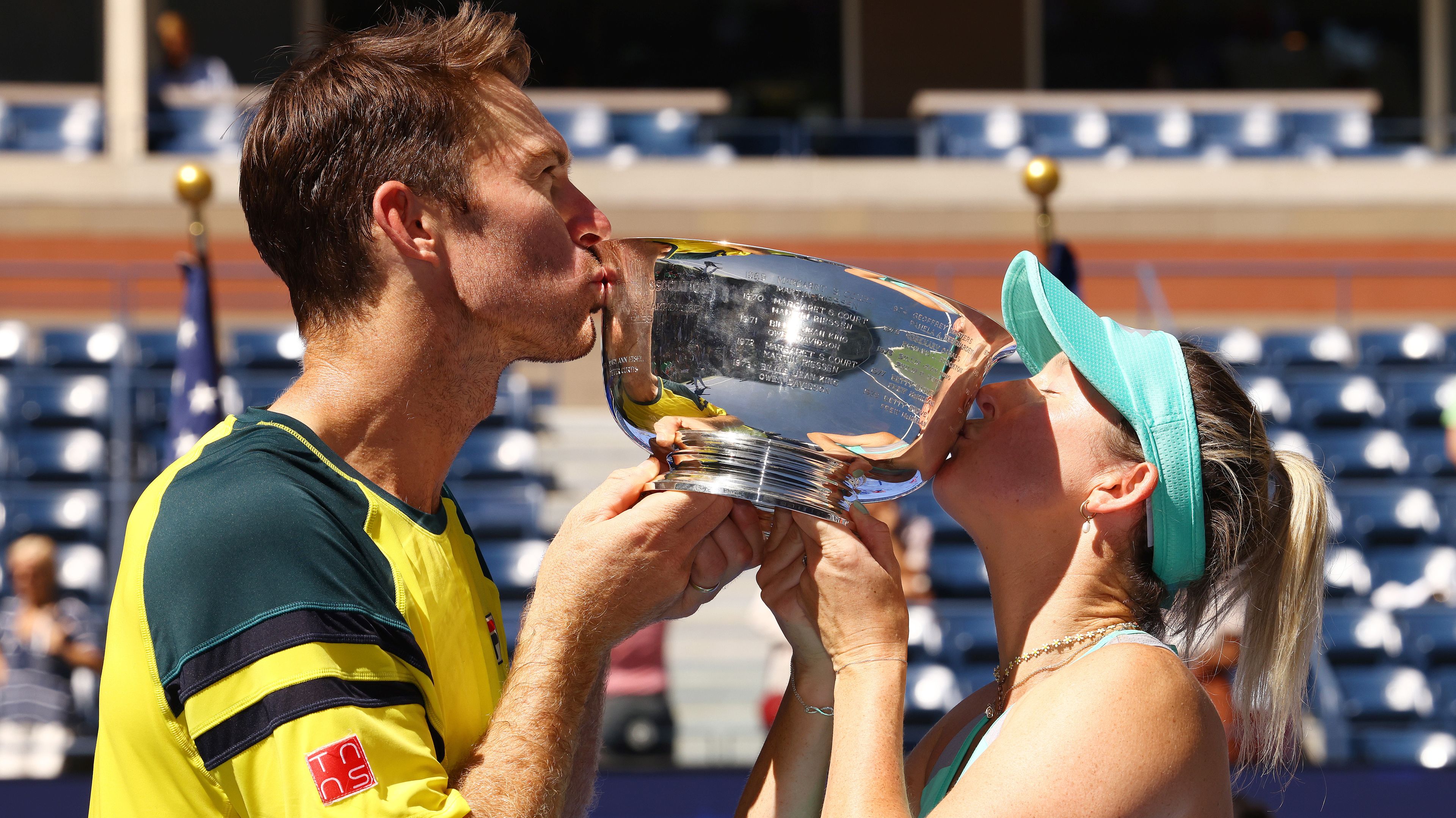 Storm Sanders (R) of Australia and John Peers (L) of Australia celebrate with the championship trophy after defeating Kirsten Flipkens of Belgium and Edouard Roger-Vasselin of France during their Mixed Doubles Final match on Day Thirteen of the 2022 US Open at USTA Billie Jean King National Tennis Center on September 10, 2022 in the Flushing neighborhood of the Queens borough of New York City. (Photo by Mike Stobe/Getty Images)