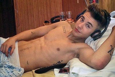 Shall we just skip this one. It's Biebs, in hospital, with a sick, we mean six pack.
