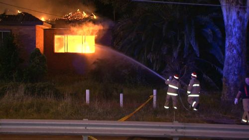 Fire crews and police were called to the house in Cartwright after receiving dozens of calls from neighbours. (9NEWS)