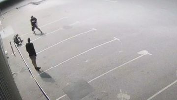 The cleaner was on a break, sitting in a carpark outside his work when two men approached him and beat him with a rock.