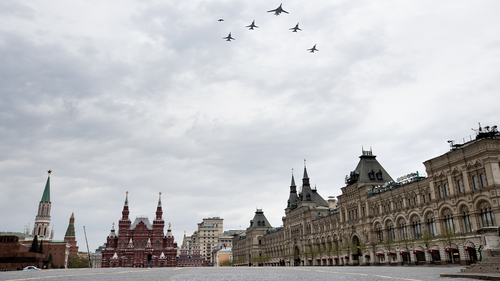 bombers, Tu-160, right, and Tu-22M3, all others, fly over almost empty Red Square in Moscow, Russia, Monday, May 4, 2020. The Russian air force conducted a rehearsal of the flyover intended to mark the 75th anniversary of the victory over the Nazis on May 9, but the planned military parade is postponed due to the coronavirus outbreak, leaving only the flyby. (AP Photo/Alexander Zemlianichenko)