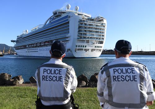 NSW Police Rescue officers look on as the Ruby Princess, with 1040 crew  onboard, docks at Port Kembla, Wollongong.