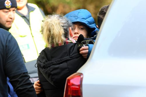 Penny Callaghan hugs her son, Will, who was found on day three of a huge search on Mt Disappointment, in Victoria.