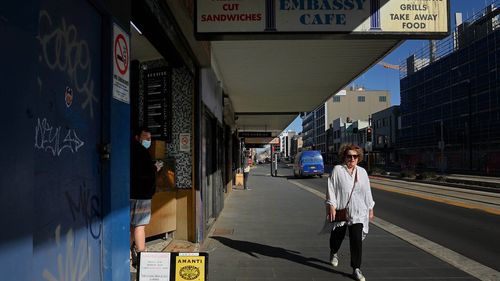 People walk along Hunter street in Newcastle during the seven day COVID-19 lockdown.