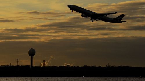 A plane takes off from Sydney airport.