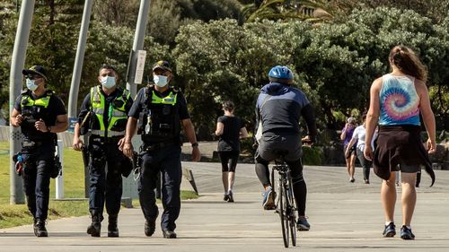 Public Service Officers patrol at St Kilda beach on October 03, 2020 in Melbourne, Australia