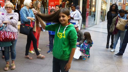 11-year-old Rahim Woods has cut off his knee-length hair for charity. (Facebook)