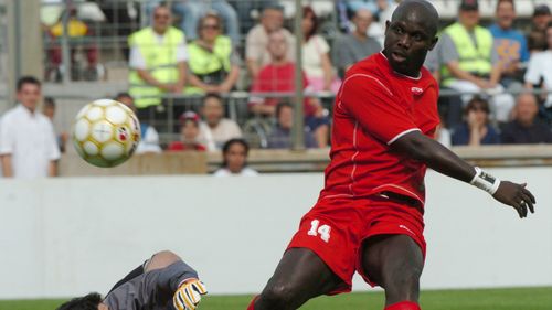 The former Liberian player George Weah , right, scores a goal during his jubilee soccer match played, in Marseille, southern France, Saturday 11, 2005. (AP Photo/Claude Paris)