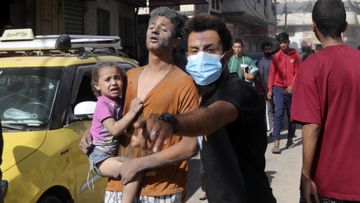 Injured Palestinians are evacuated following Israeli airstrikes on town of Khan Younis, southern Gaza Strip, Thursday, Oct. 26, 2023.