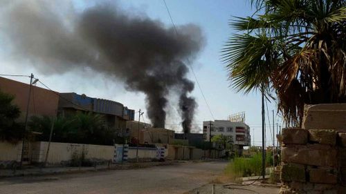 Smoke rises after bombing targeting Islamic State positions in Fallujah. (AP)