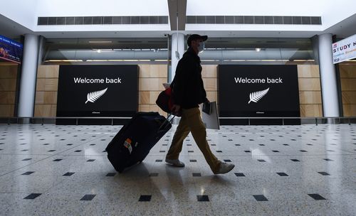 A perfect Sydney airport snapshot to illustrate Australia re-opening its borders to New Zealand under the trans-Tasman bubble. (Photo by James D. Morgan/Getty Images)