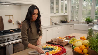 Meghan, the Duchess of Sussex, shows how to make a rainbow fruit salad on the set of With Love, Meghan.