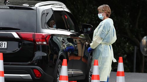 A nurse speaks to a member of the public at a drive through Covid 19 testing station in Auckland, New Zealand.
