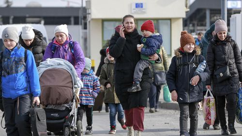 Refugees from Ukraine arrive at the Medyka border crossing in Poland