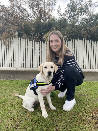 Casey with seeing eye dog puppy in training, Flossy.