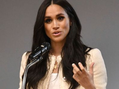 Britain's Meghan, Duchess of Sussex, speaks during a school assembly as part of a surprise visit to the Robert Clack Upper School in Dagenham, Essex, in eastern London, to celebrate International Women's Day, Friday, March 6, 2020