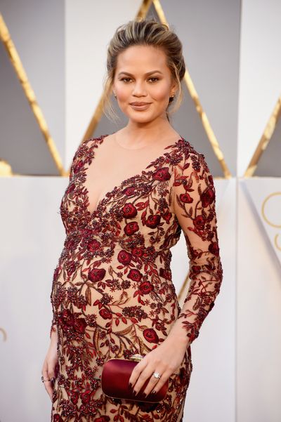 When your bump is this big there's no point in trying to hide it - and anyway, why would you want to? Chrissy is heaven in burgundy lace with a hint of cleavage.
