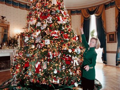Former US First Lady Hillary Clinton with her White House Christmas tree in 1997.
