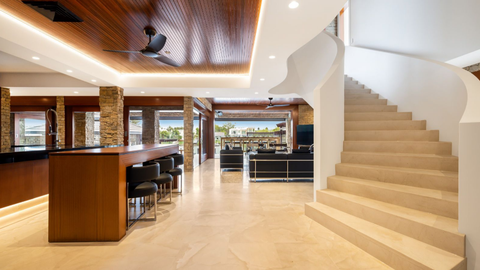 Property for sale in Benowa Waters, Queensland, with fossil-infused limestone flooring.