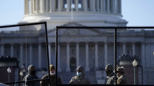 Barriers are erected around Capitol Hill following yesterday's riots.