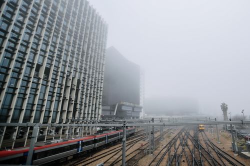 Fog on top of the train tracks in the Adelaide CBD can be seen from the Morphett Bridge in Adelaide. Picture: AAP