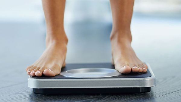 Woman weighing herself