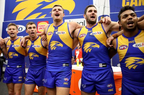 Eagles players celebrate after winning the Second Qualifying Final. (AAP)