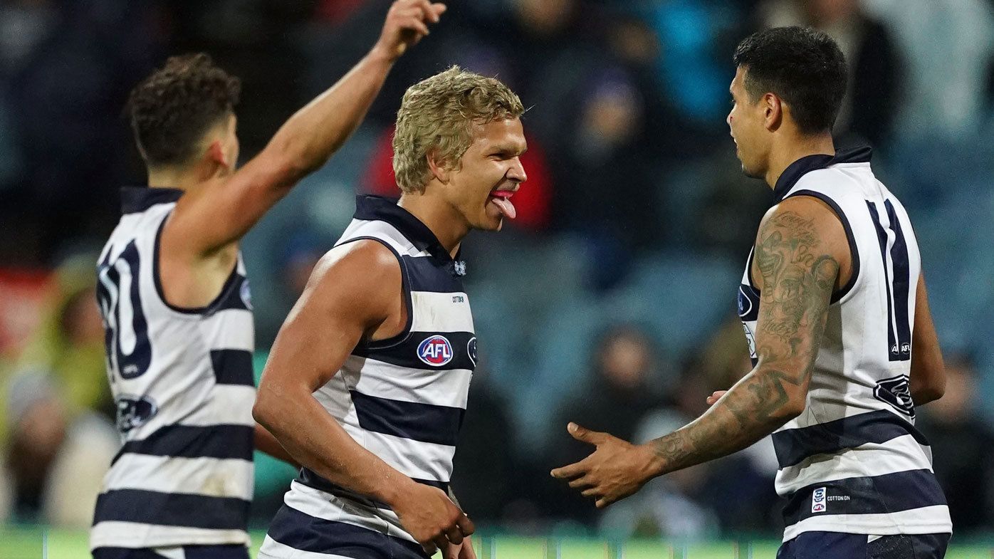 The Cats have dominated North Melbourne in an historical night of AFL